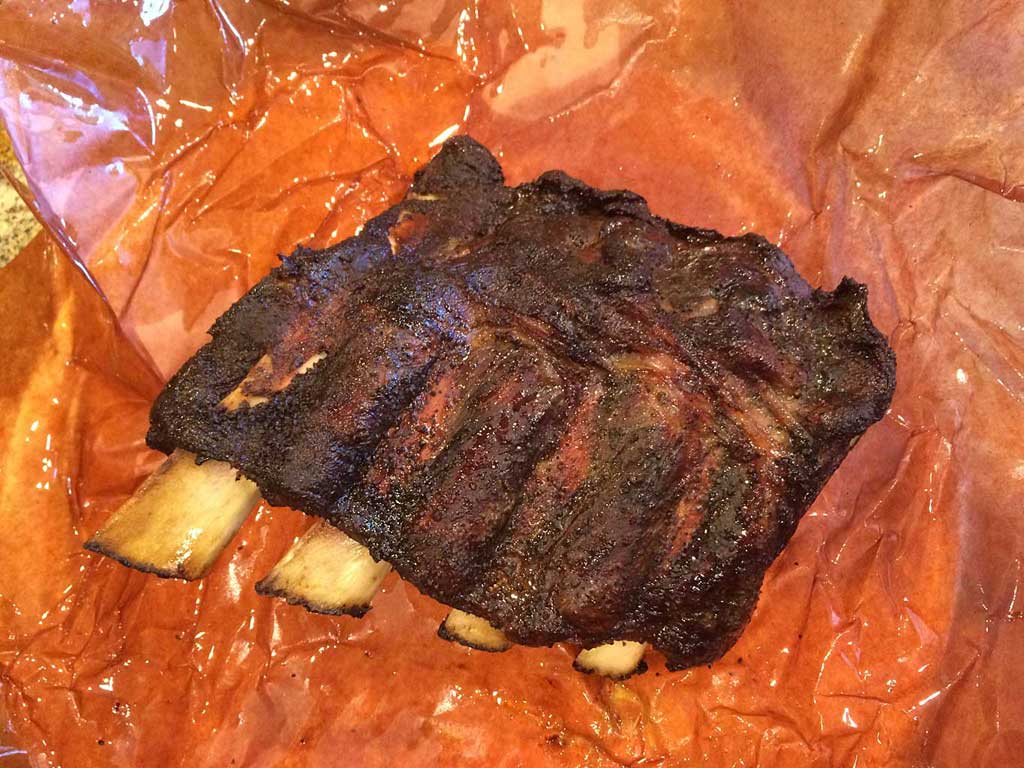 Wrapping Ribs in Butcher Paper: Enhancing Rib Flavor and Texture