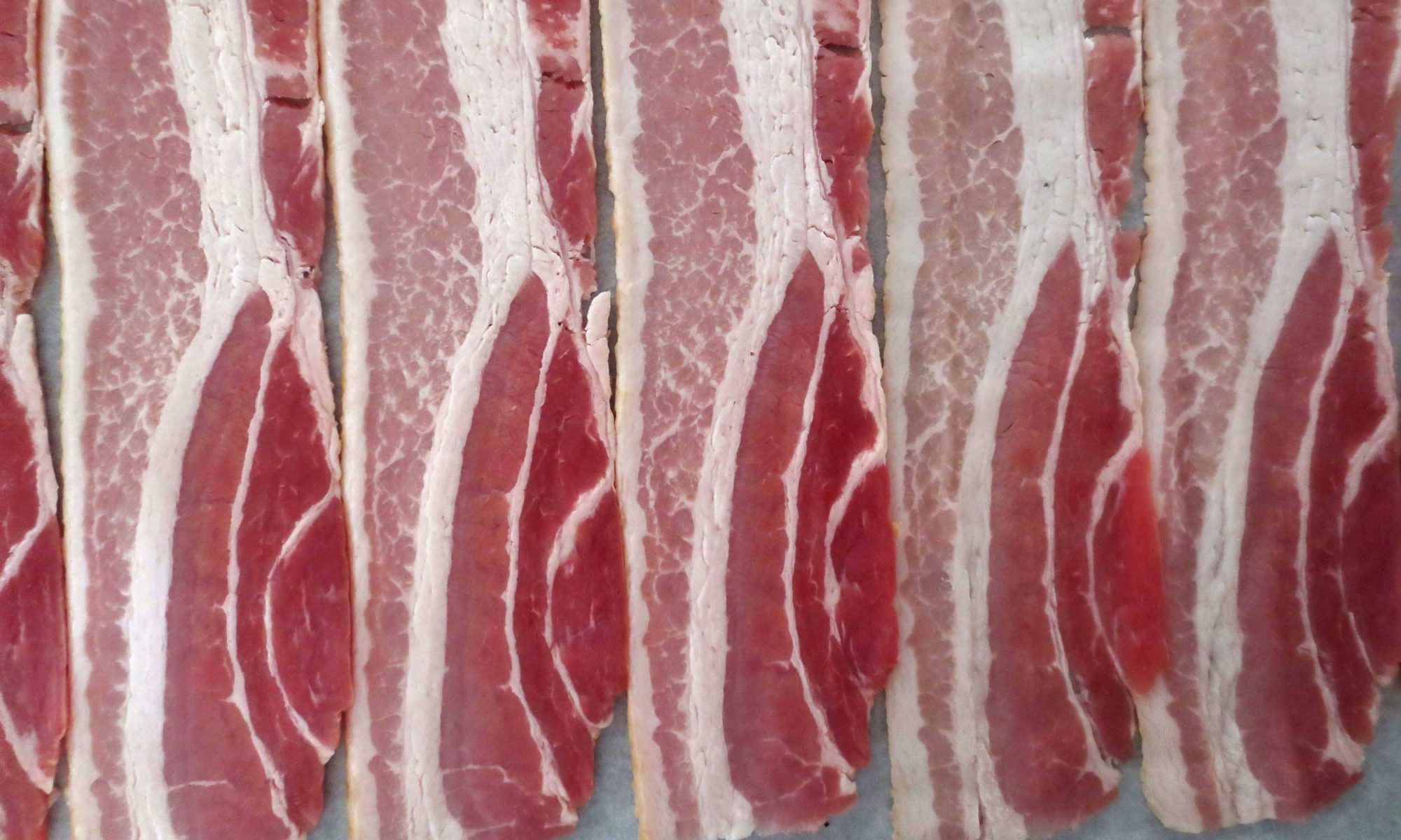 How Long Can Cooked Bacon Sit Out: Ensuring Bacon Safety